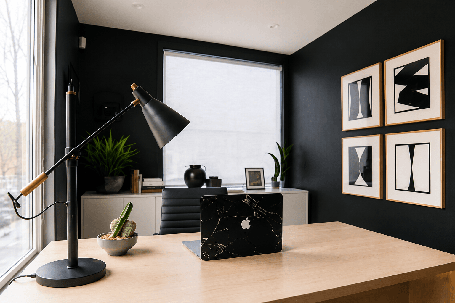 AcePartners BPO team workspace with a laptop, desk lamp, and framed art